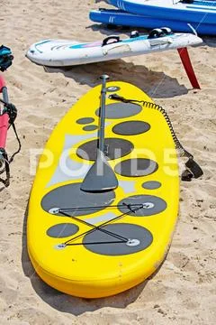 Surfboards lying on the beach at sunny day in summer, colorful surfboard on the Stock Photos