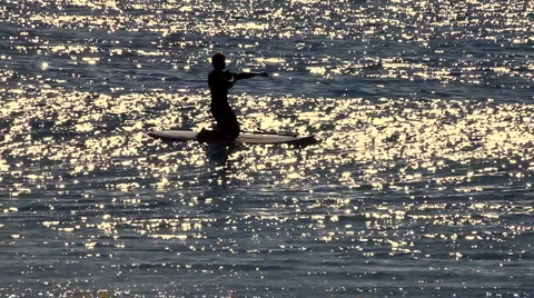 Surfer 01 - putting on wetsuit Stock Footage 5088896
