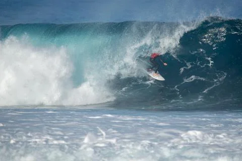 Surfer in action on a big wave Stock Photos