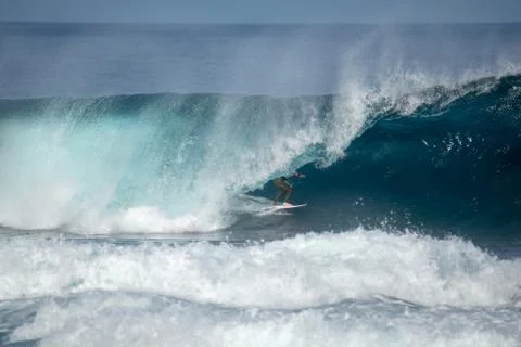 Surfer in action on a big wave Stock Photos