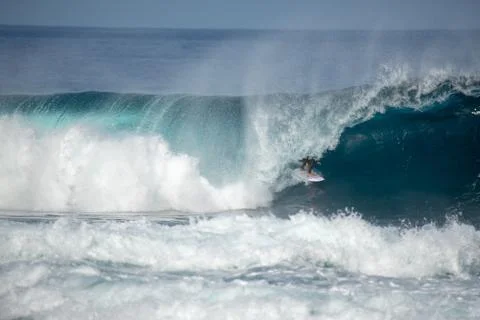 Surfer in action on a big wave Stock Photos