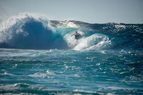 Surfer in action on a big wave Stock Photos