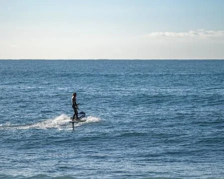 Surfer in action on the sea Stock Photos