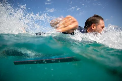 Surfer in action on the wave Stock Photos