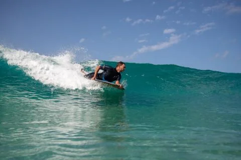 Surfer in action on the wave Stock Photos
