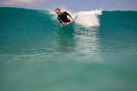 Surfer in action on the wave Stock Photos