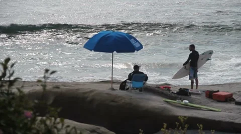 Surfer and Lifeguard Stock-Footage 7759189