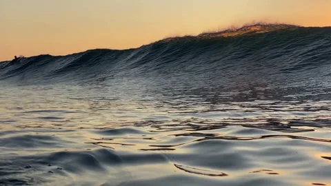 Surfer and Ocean wave at sunset time  스톡 동영상 296167685