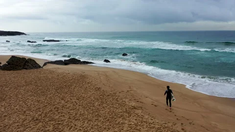SURFER arriving in the beach Stock Footage 150120994