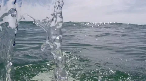 A Surfer Balances On His Board As A Wave Passes Over Him. Stock Footage 50954833
