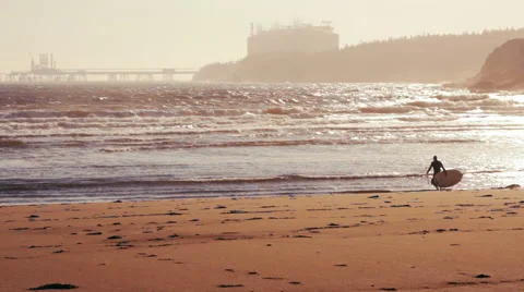 Surfer on the Beach during Sunset. Stock Footage 68170363