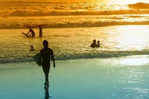 Surfer on beach Stock Photos