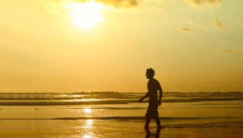Surfer on beach Stock Photos