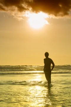 Surfer on beach Stock Photos