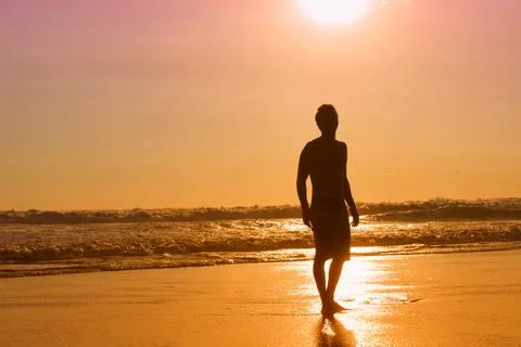Surfer on beach Stock Photos