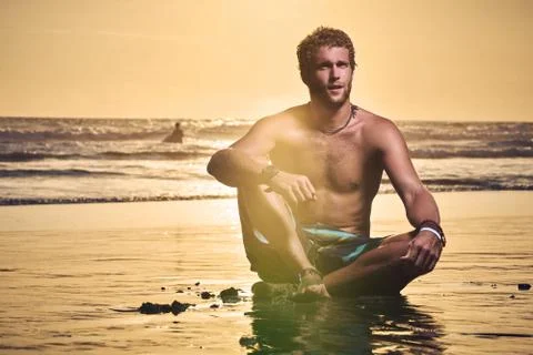 Surfer on beach Stock Photos