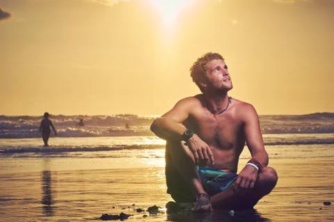 Surfer on beach Stock Photos