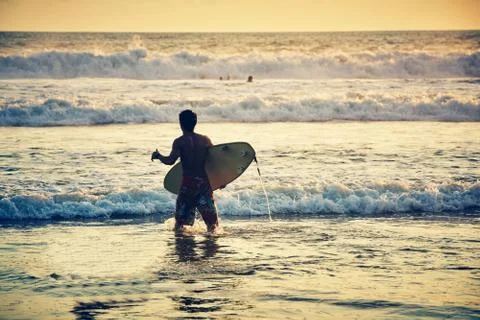 Surfer on beach Stock Photos