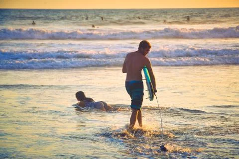 Surfer on beach Stock Photos
