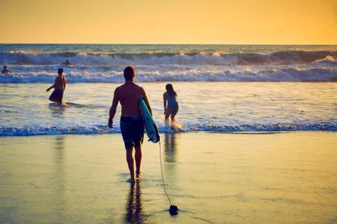 Surfer on beach Stock Photos