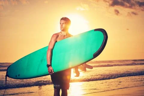 Surfer on beach Stock Photos