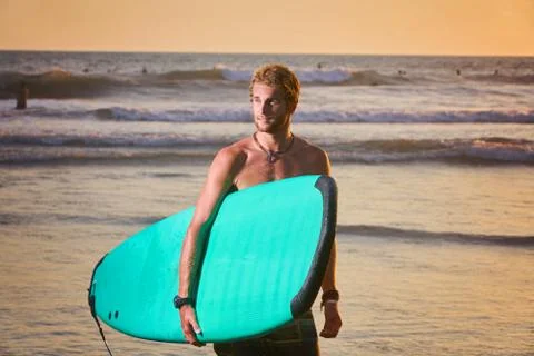 Surfer on beach Stock Photos