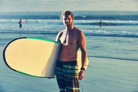 Surfer on beach Stock Photos