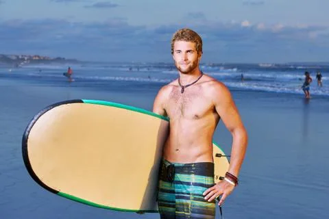Surfer on beach Stock Photos