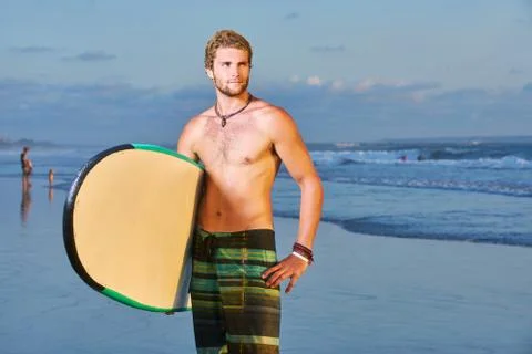 Surfer on beach Stock Photos