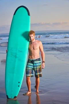 Surfer on beach Stock Photos