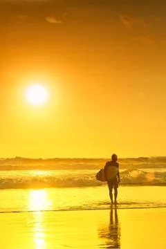 Surfer on beach Stock Photos