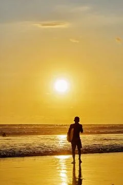 Surfer on beach Stock Photos