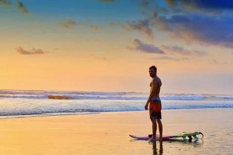 Surfer on beach Stock Photos