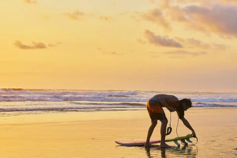 Surfer on beach Stock Photos