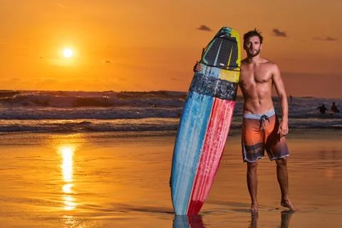 Surfer on beach Stock Photos