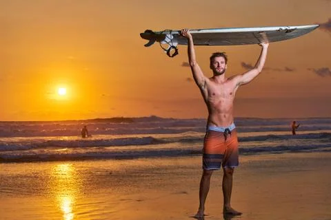 Surfer on beach Stock Photos