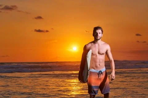 Surfer on beach Stock Photos