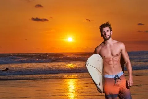 Surfer on beach Stock Photos