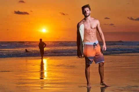 Surfer on beach Stock Photos