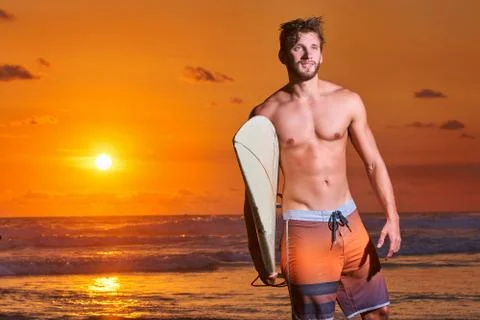Surfer on beach Stock Photos