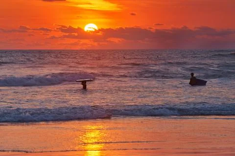 Surfer on beach Stock Photos