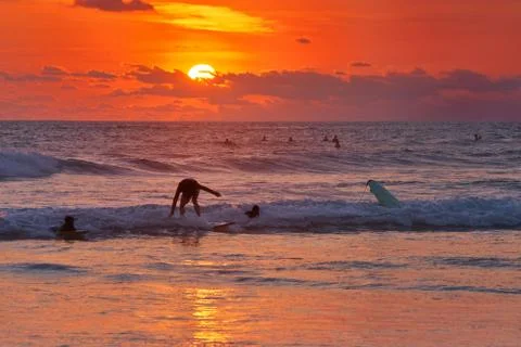 Surfer on beach Stock Photos