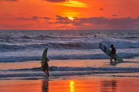 Surfer on beach Stock Photos