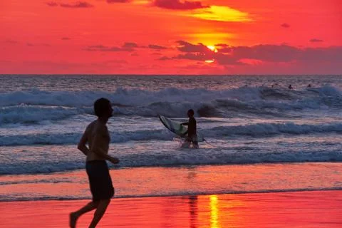 Surfer on beach Stock Photos
