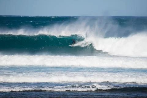 Surfer in a big wave Stock Photos