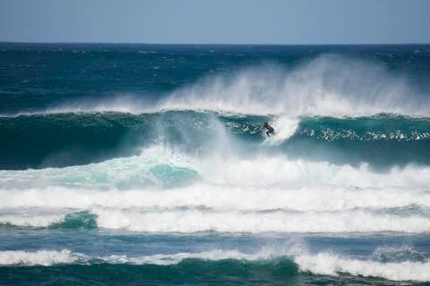 Surfer in a big wave Stock Photos