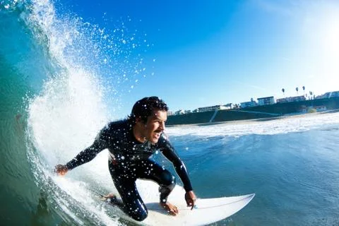 Surfer on blue ocean wave Stock Photos