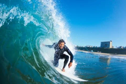 Surfer on blue ocean wave Stock Photos