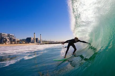 Surfer on blue ocean wave Stock Photos