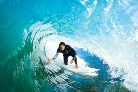 Surfer on blue ocean wave Stock-Fotos
